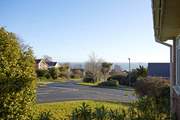 Looking down the road towards the village centre, seafront and beaches.