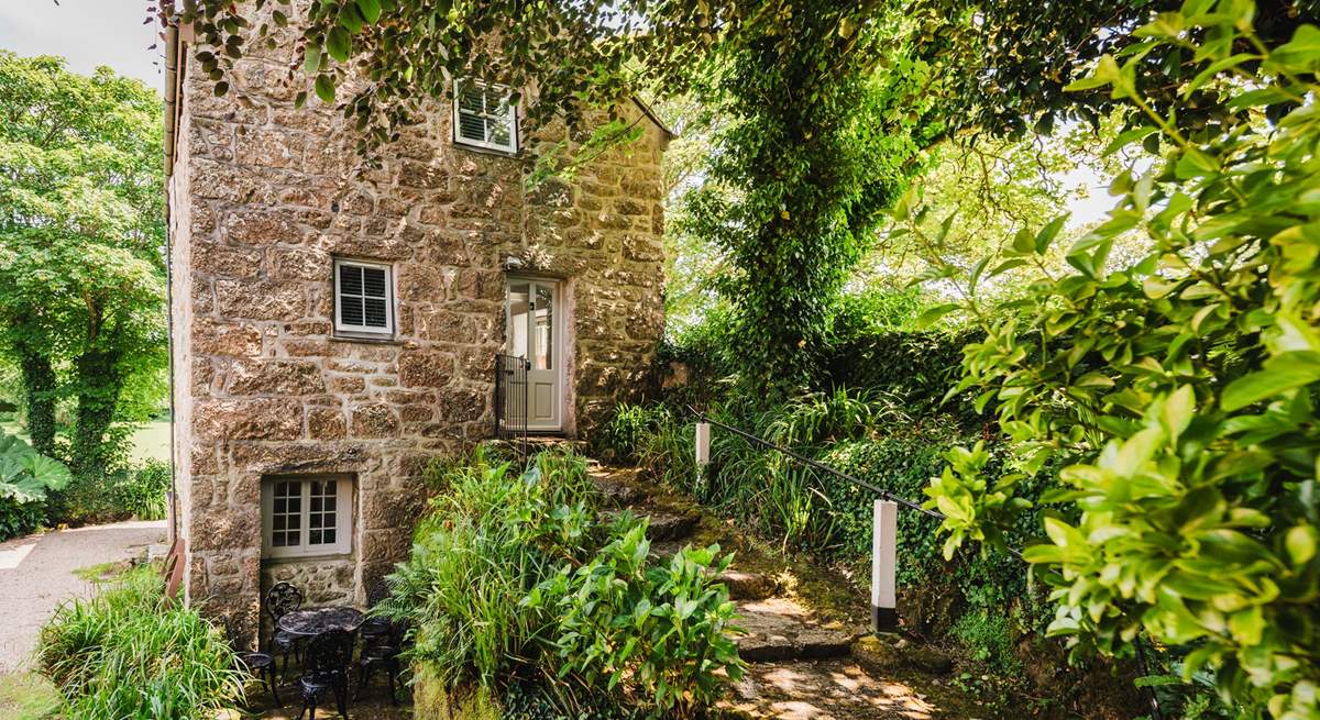 Ancient granite steps lead to the traditional door of this historic property.