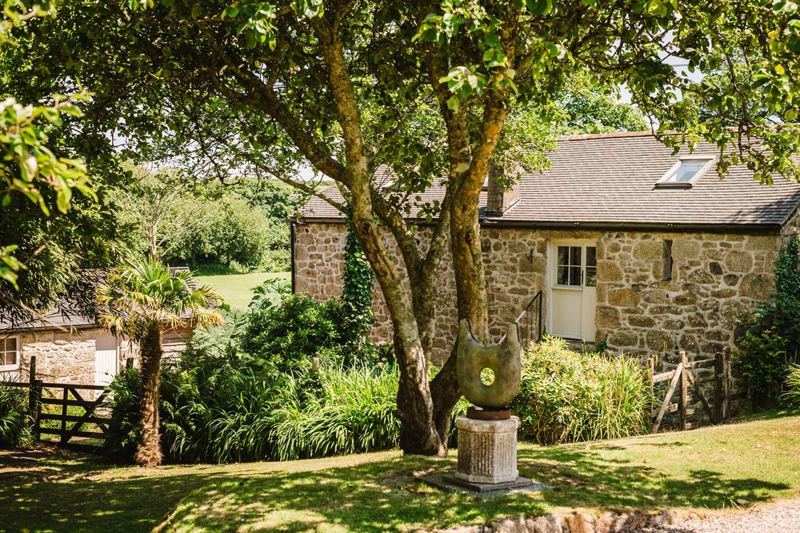 Roskennals Mill is surrounded by native plants.