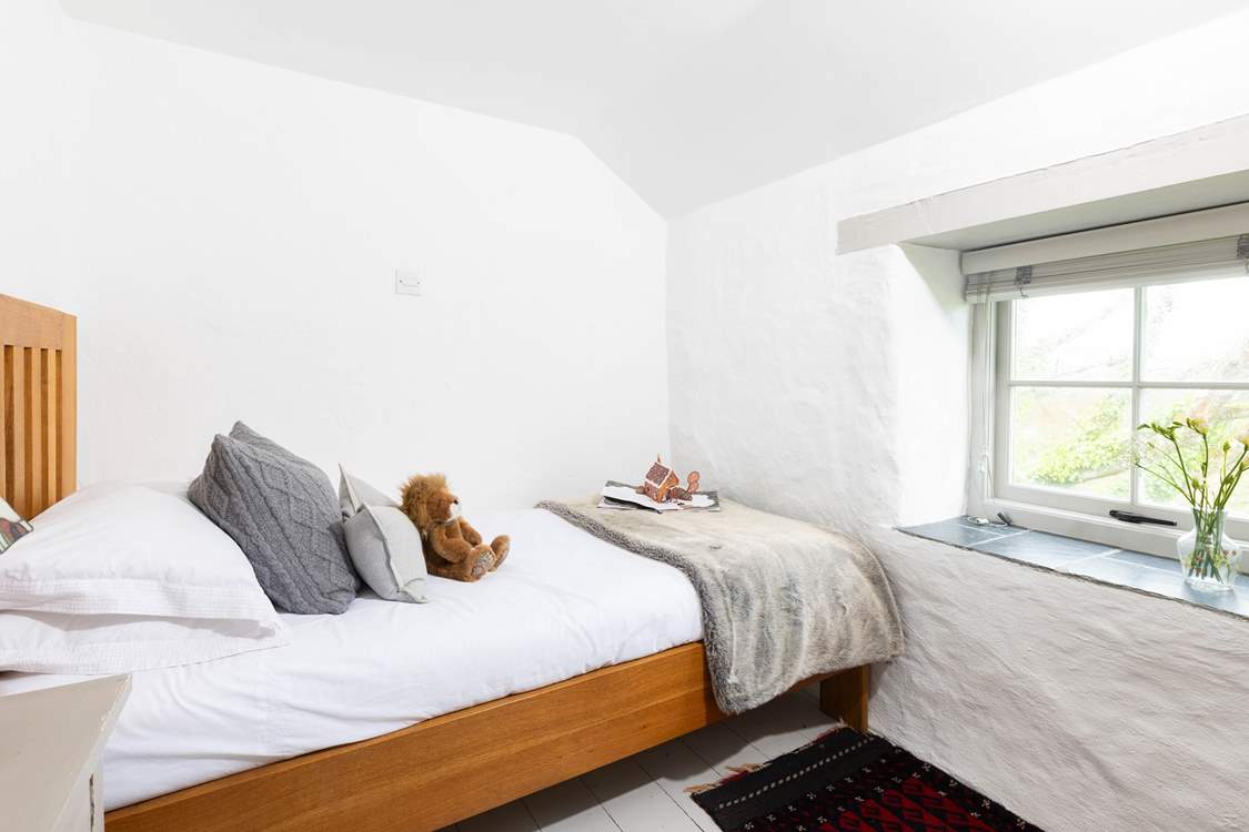 The charming single bedroom, wake up and gaze out over to the beautiful gardens.