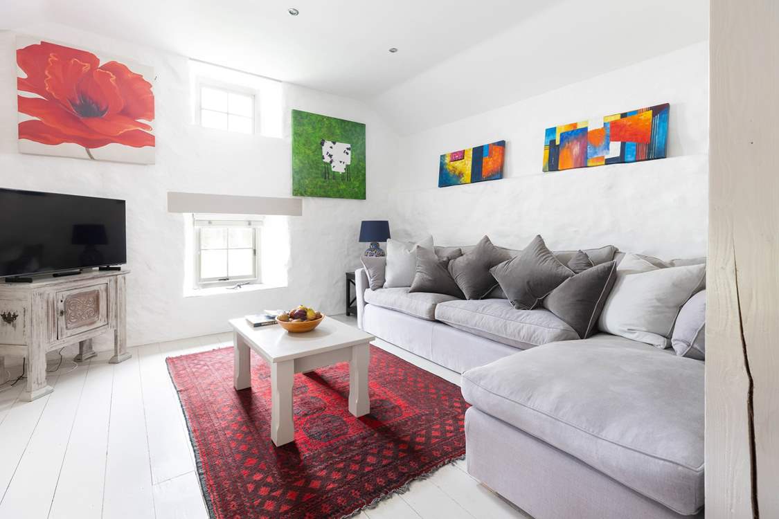 Snuggle up on the luxurious sofa in this traditionally restored cottage.