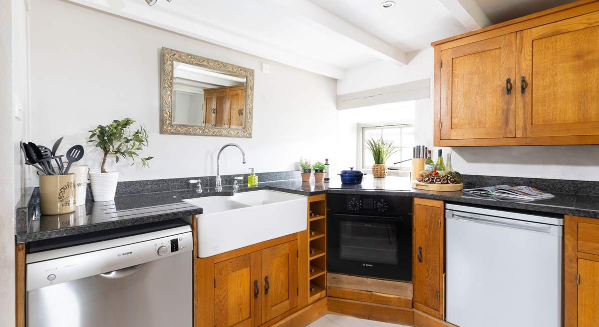 A kitchen with high end appliances and super butler sink.