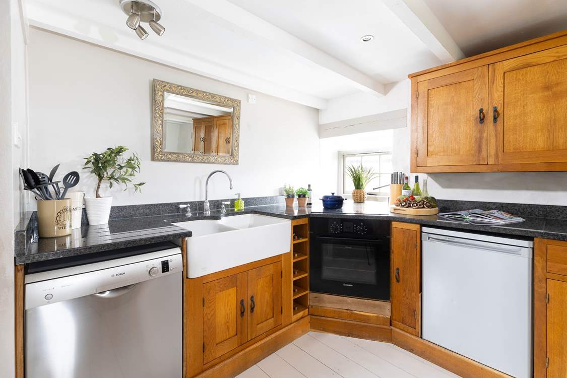 A kitchen with high end appliances and super butler sink.