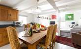 Gather round the solid oak dining-table in a space full of natural light. - Thumbnail Image