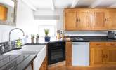 A bespoke kitchen with polished granite worktops represent the quality that continues throughout this gorgeous home. - Thumbnail Image