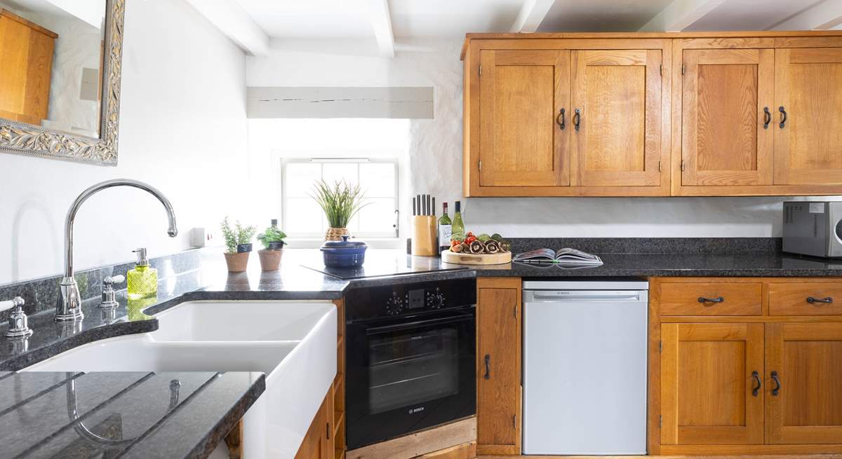 A bespoke kitchen with polished granite worktops represent the quality that continues throughout this gorgeous home.