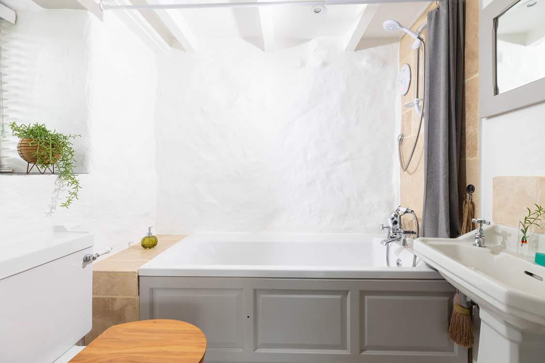 A modern bathroom located downstairs.