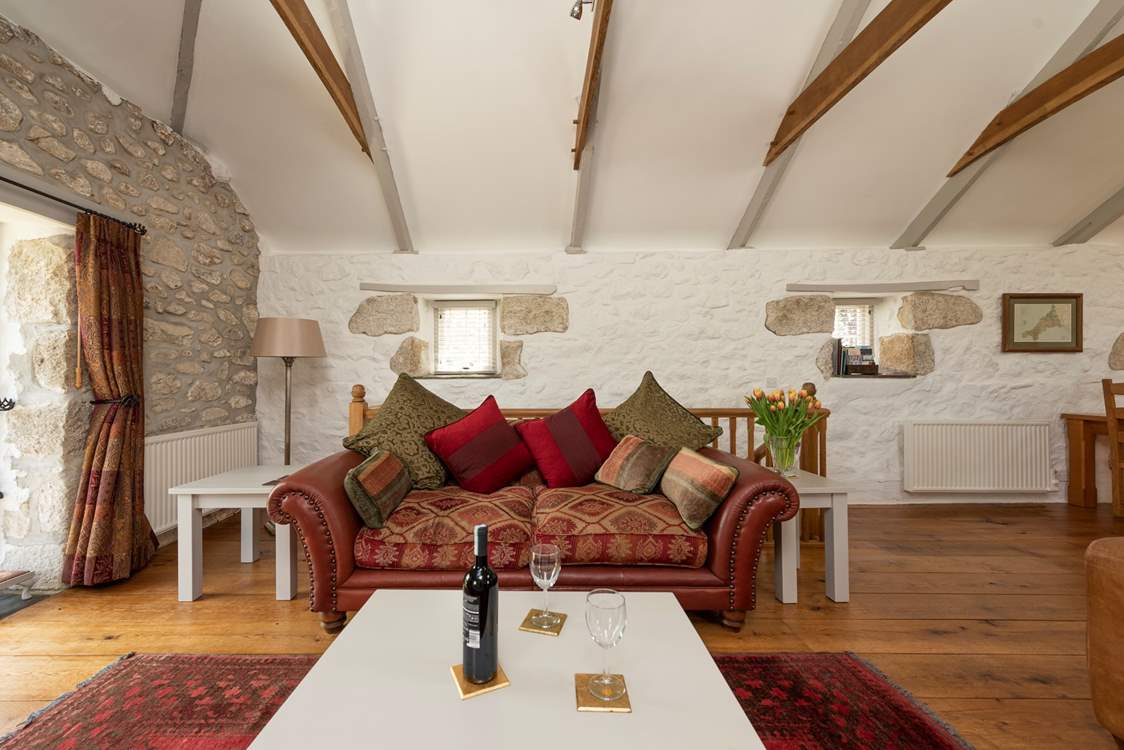 Sit back, pour a glass of wine and relax on the elegant sofas.