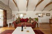 Sit back, pour a glass of wine and relax on the elegant sofas.