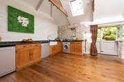 The bespoke kitchen is fully equipped to cook up a feast.