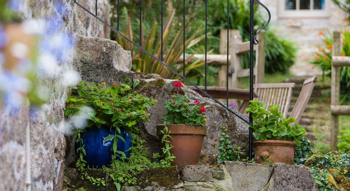 Ancient granite steps lead down to the garden.