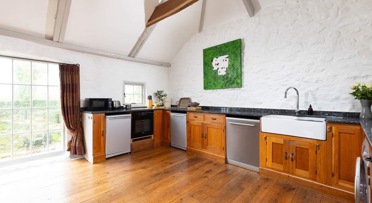 Granite worktops, large butler sink and polished floor boards make the kitchen a modern space but still appreciating the original charm.