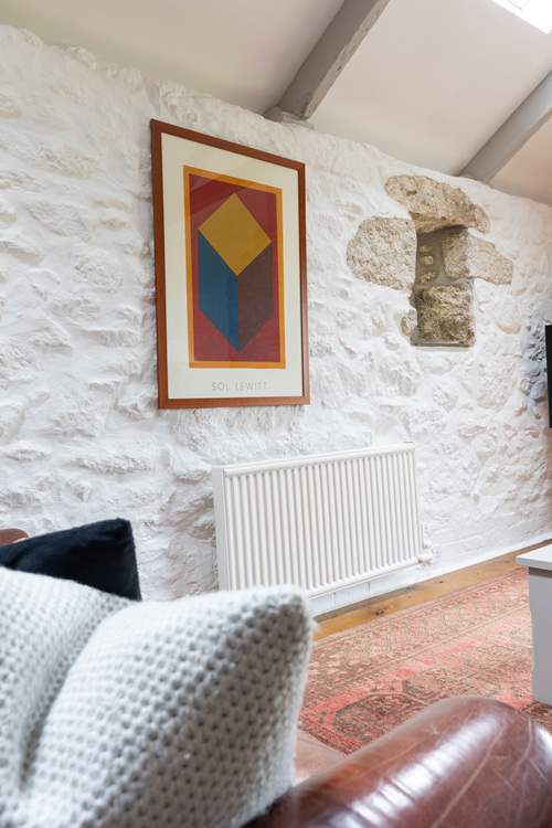 Modern art adds charm to the historic cottage.