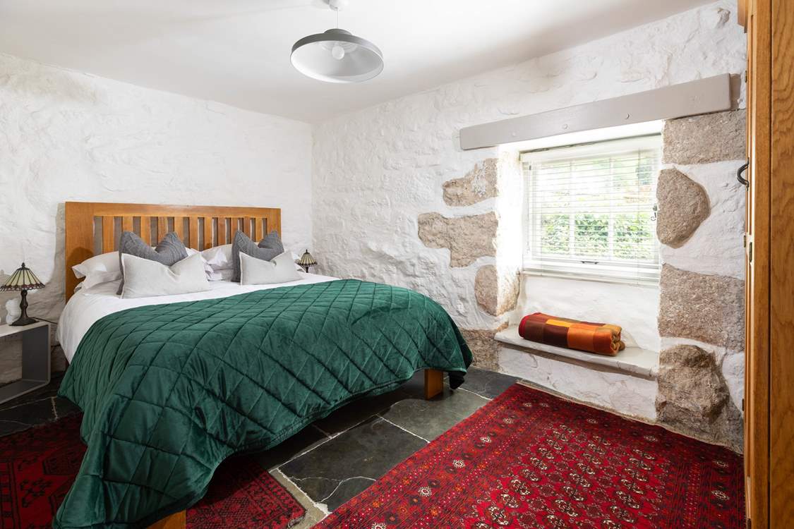 The king-size bedroom overlooking the stunning grounds.