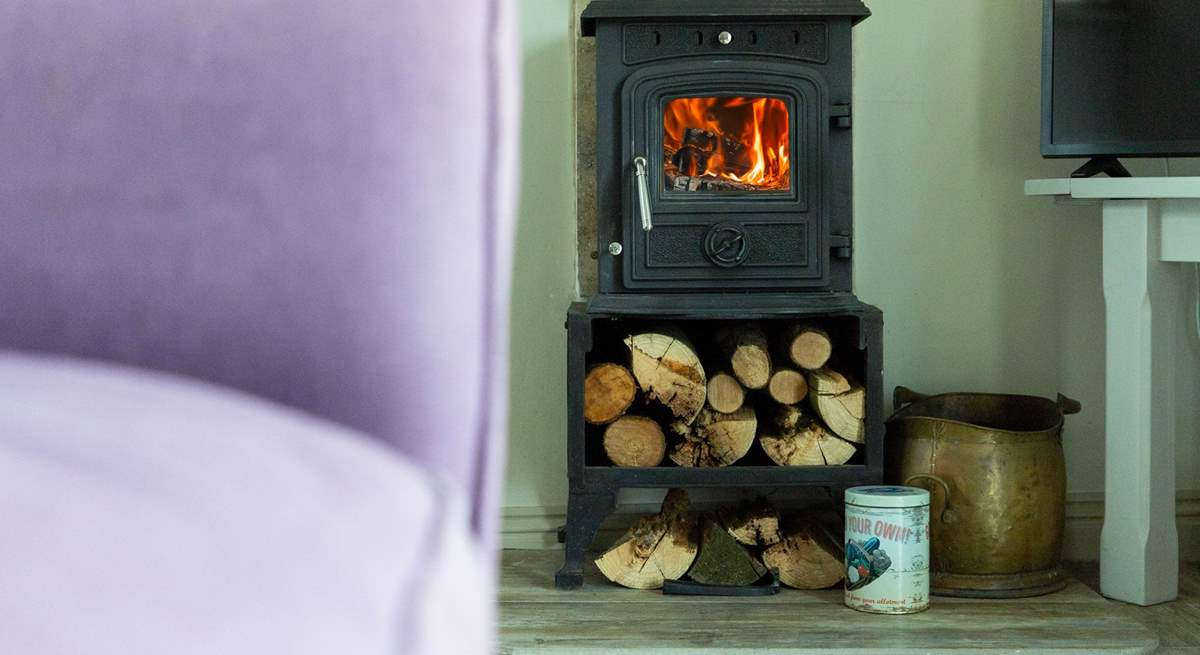 The sweet wood-burner fills this cosy cottage with warmth.