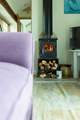 The sweet wood-burner fills this cosy cottage with warmth.