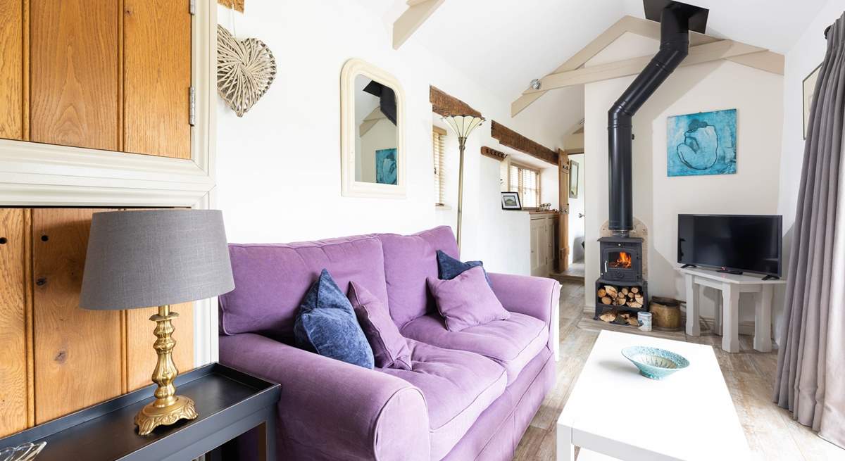 Sink into the comfy sofa next to the warmth of the wood-burner on a chilly evening.