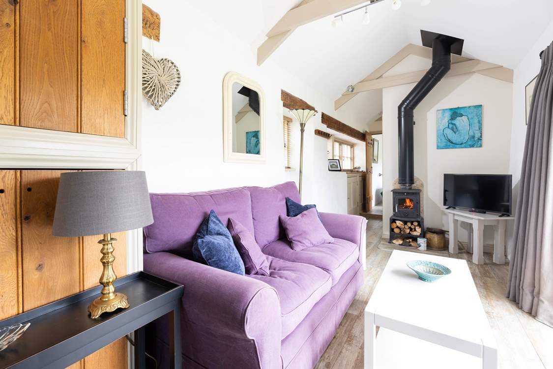 Sink into the comfy sofa next to the warmth of the wood-burner on a chilly evening.