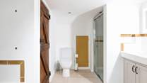 As well as the bath there is a separate shower tucked away.
