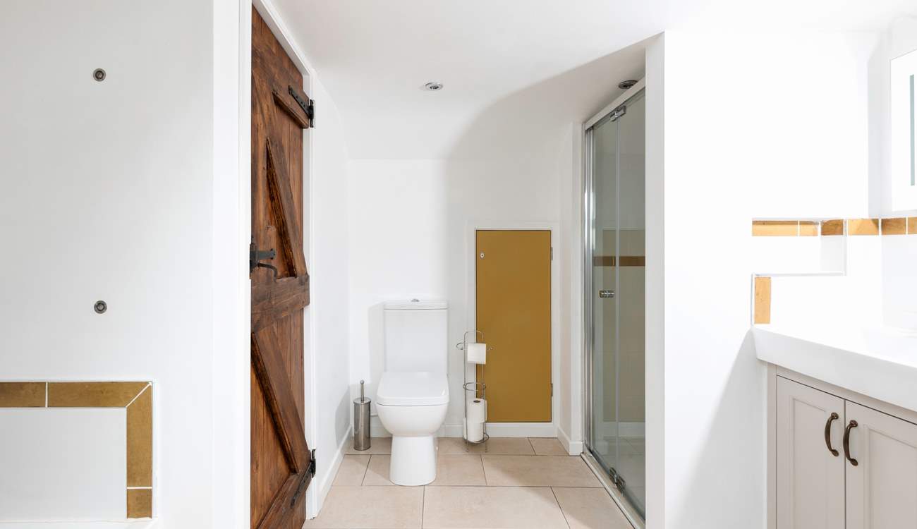 As well as the bath there is a separate shower tucked away.