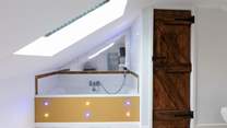 The wonderfully quirky bathroom is at the top of the stairs from Bedroom 1.