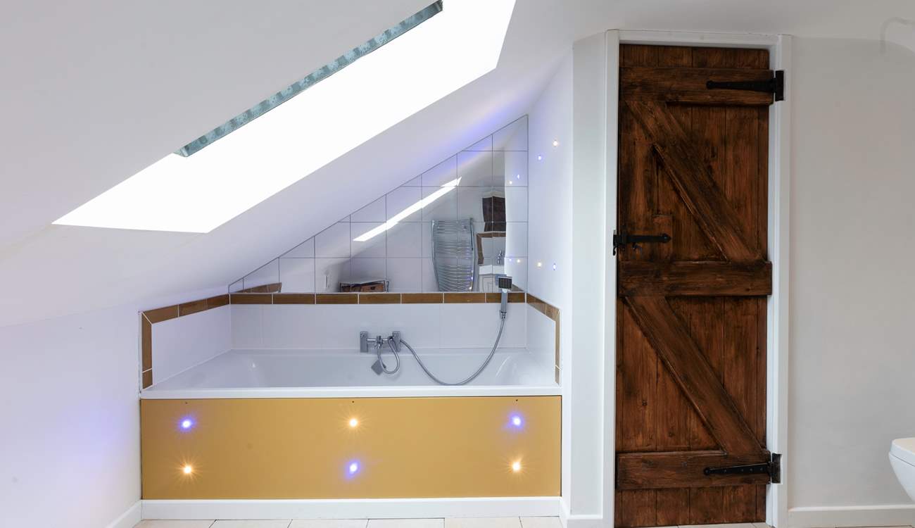 The wonderfully quirky bathroom is at the top of the stairs from Bedroom 1.