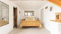 Just off the open plan sitting-room is Bedroom 1 with a large walk-in wardrobe.