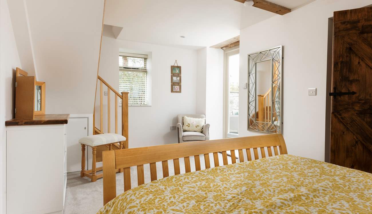 Stairs lead up to the bathroom.