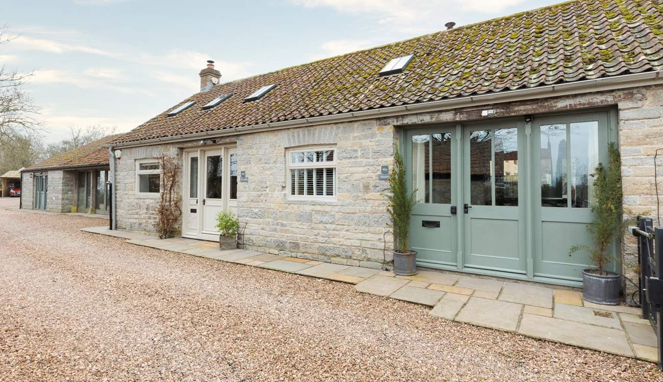 The Smithy is on the left-hand side (with the cream doors) and Minstrels is on the right (green doors). Both properties have a high level of privacy.