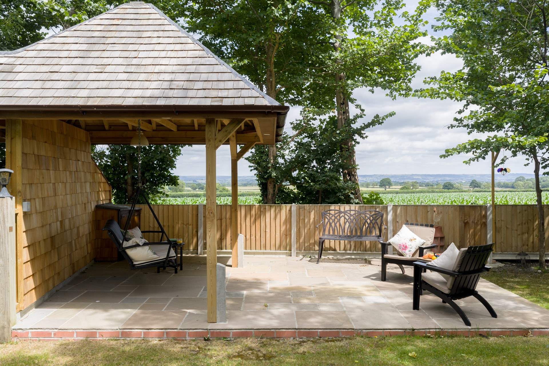 Take a seat on the swing bench and you can see right to Glastonbury Tor. Please note this garden area is shared with guests at Minstrels.