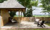 Take a seat on the swing bench and you can see right to Glastonbury Tor. Please note this garden area is shared with guests at Minstrels. - Thumbnail Image