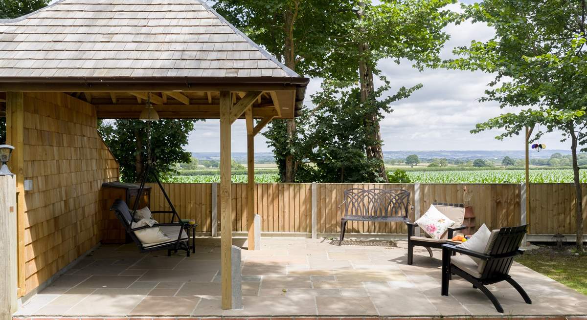 Take a seat on the swing bench and you can see right to Glastonbury Tor. Please note this garden area is shared with guests at Minstrels.