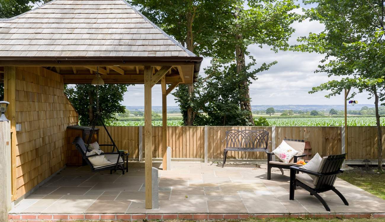 Take a seat on the swing bench and you can see right to Glastonbury Tor. Please note this garden area is shared with guests at Minstrels.