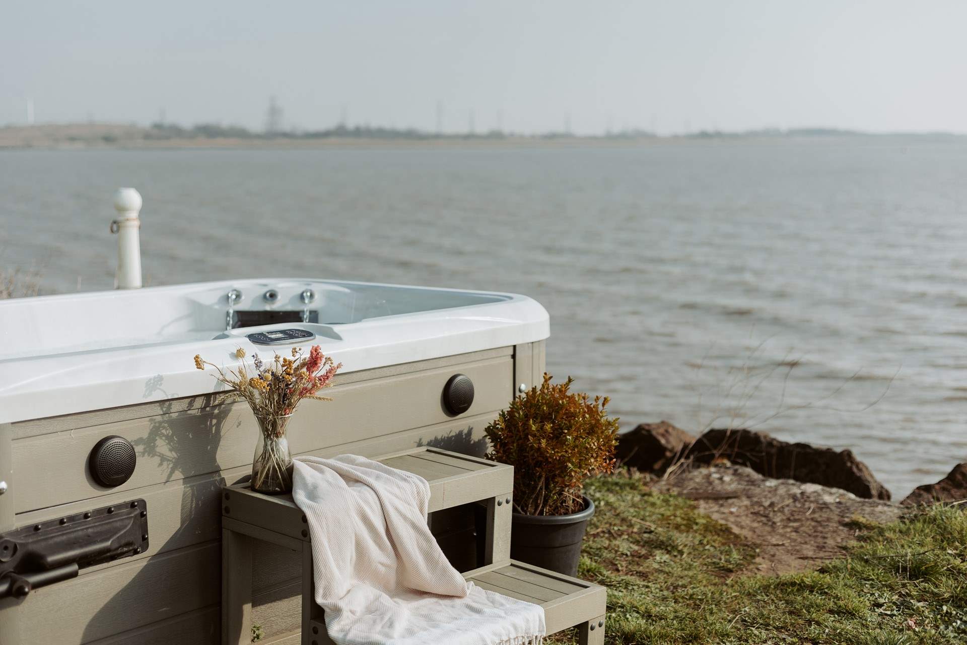 Soak in the bubbling hot tub and admire the unforgettable setting.