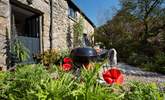 Enjoy a barbecue in the pretty garden in front of the cottage. - Thumbnail Image