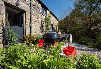 Enjoy a barbecue in the pretty garden in front of the cottage.
