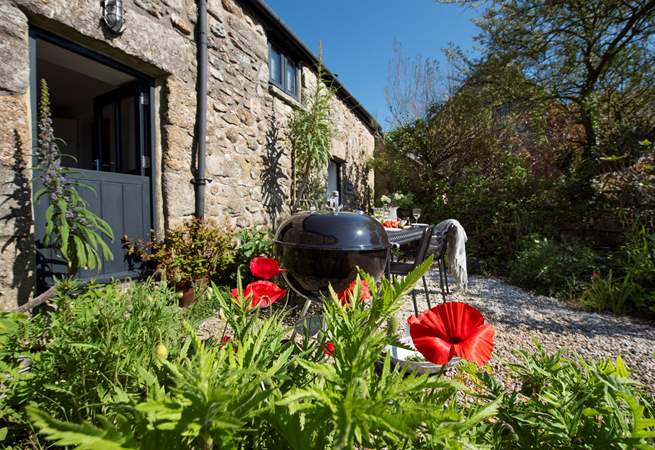 Enjoy a barbecue in the pretty garden in front of the cottage.