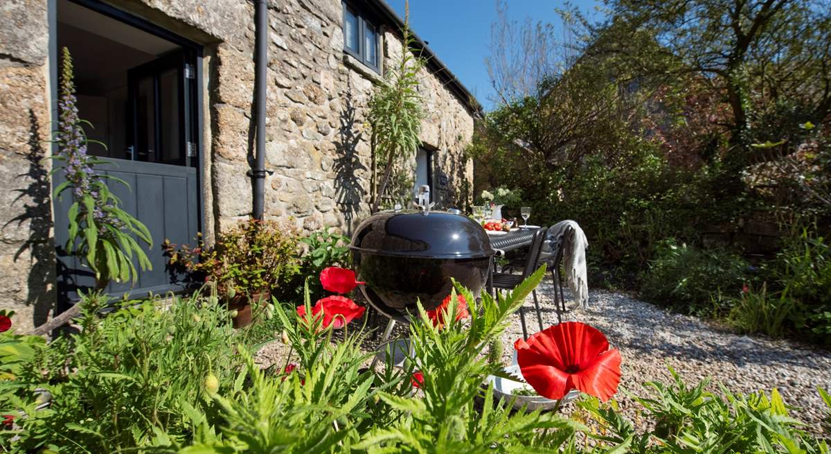 Enjoy a barbecue in the pretty garden in front of the cottage.
