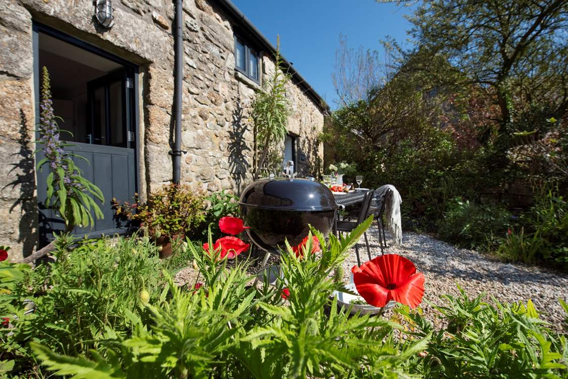 Enjoy a barbecue in the pretty garden in front of the cottage.