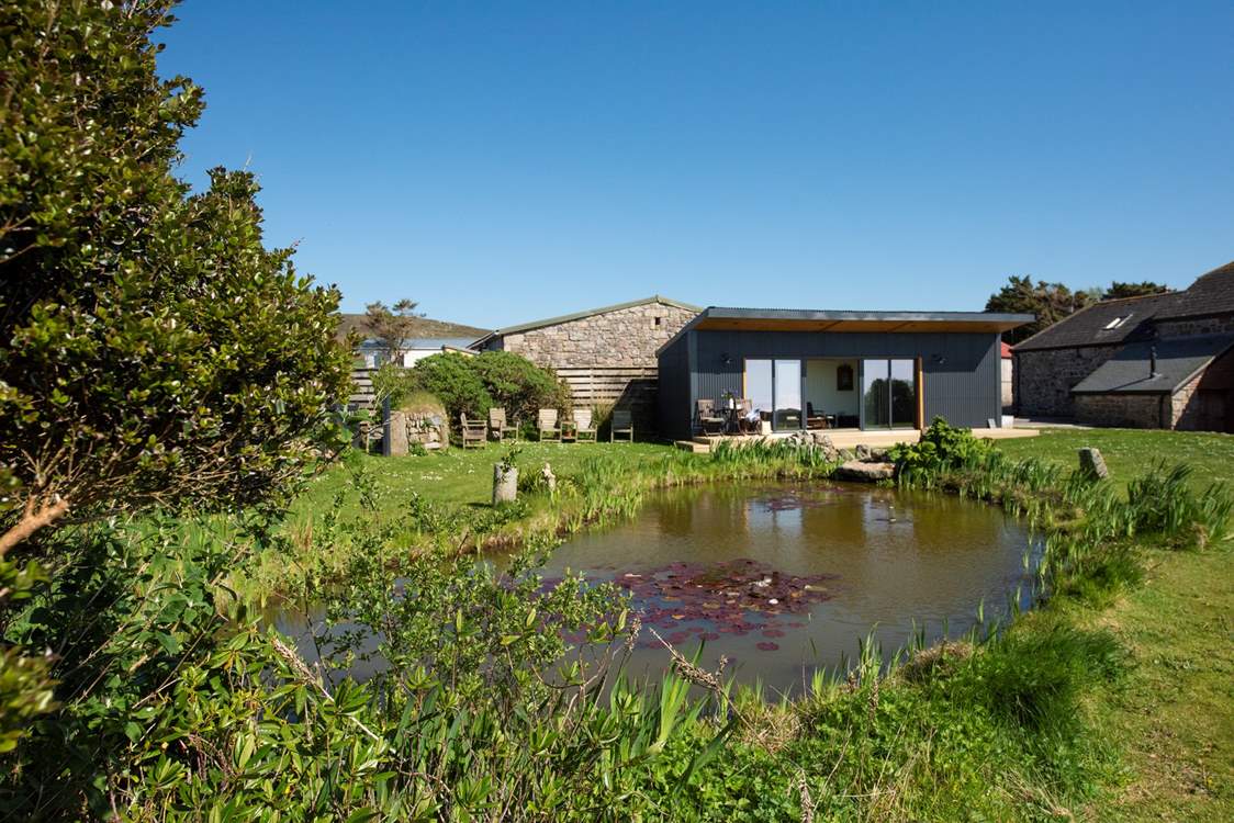 The garden cabin is situated in the grounds next to an organic pond. This is the perfect spot to watch the sun go down with a glass of bubbles.