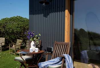 Share some holiday memories in front of the garden cabin.