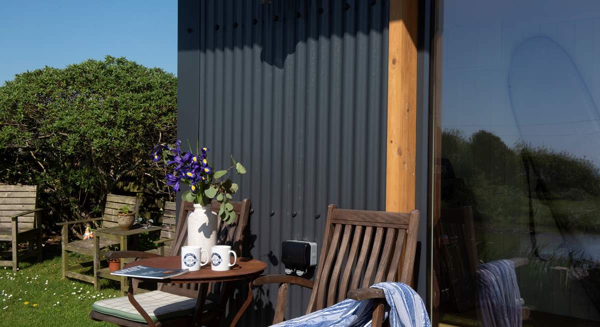 Share some holiday memories in front of the garden cabin.