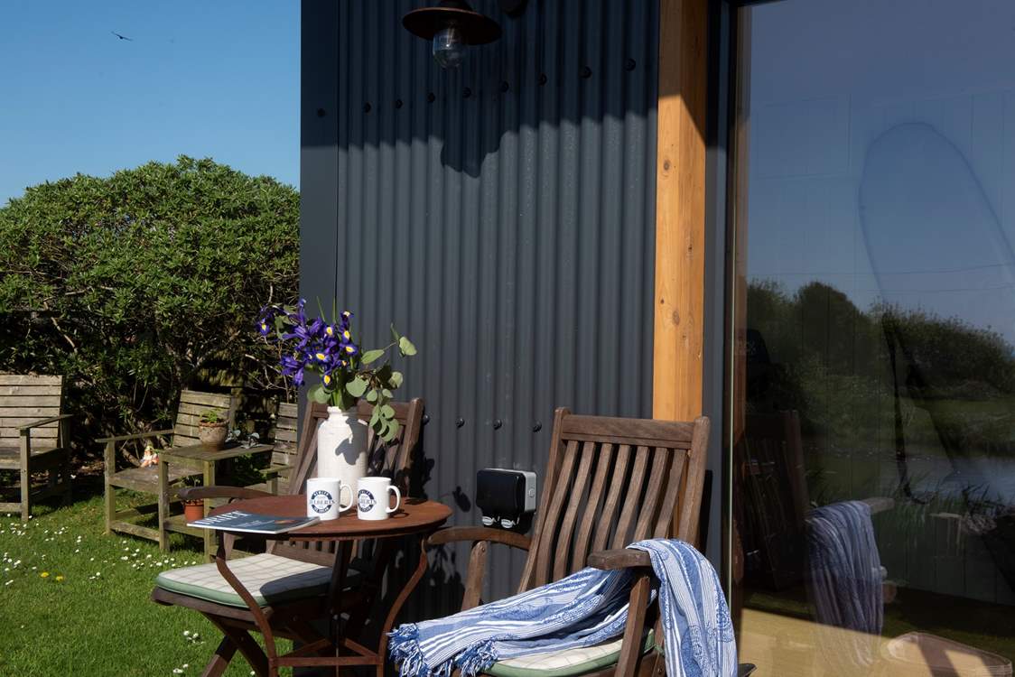 Share some holiday memories in front of the garden cabin.