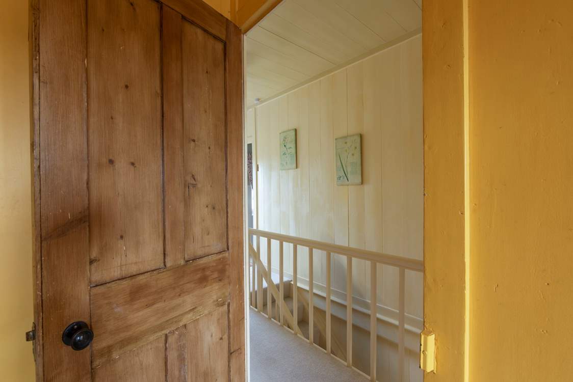 Preserved wood panelling add to the charm of Glebe Farmhouse.