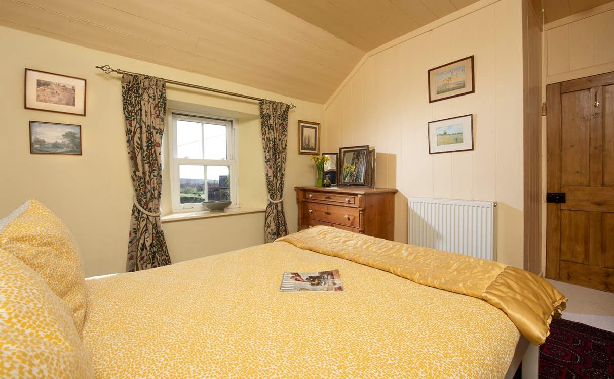 Sweet original windows fill the room with light.