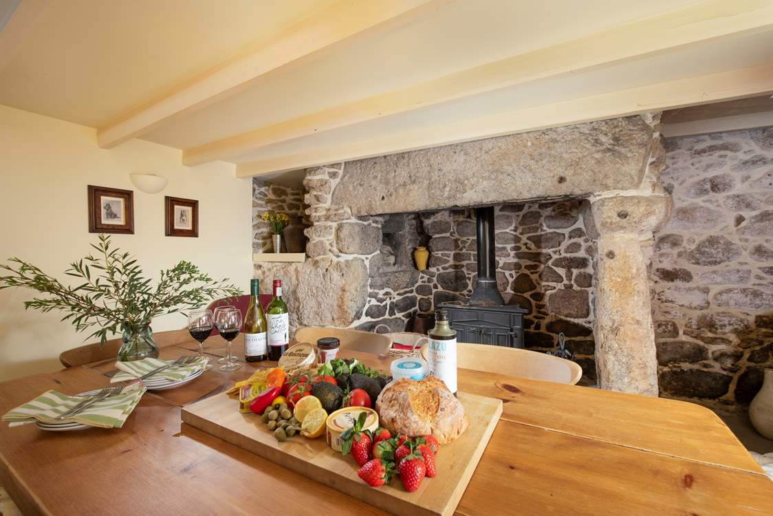 A warm and inviting dining-room, at the heart, this magnificent fireplace.