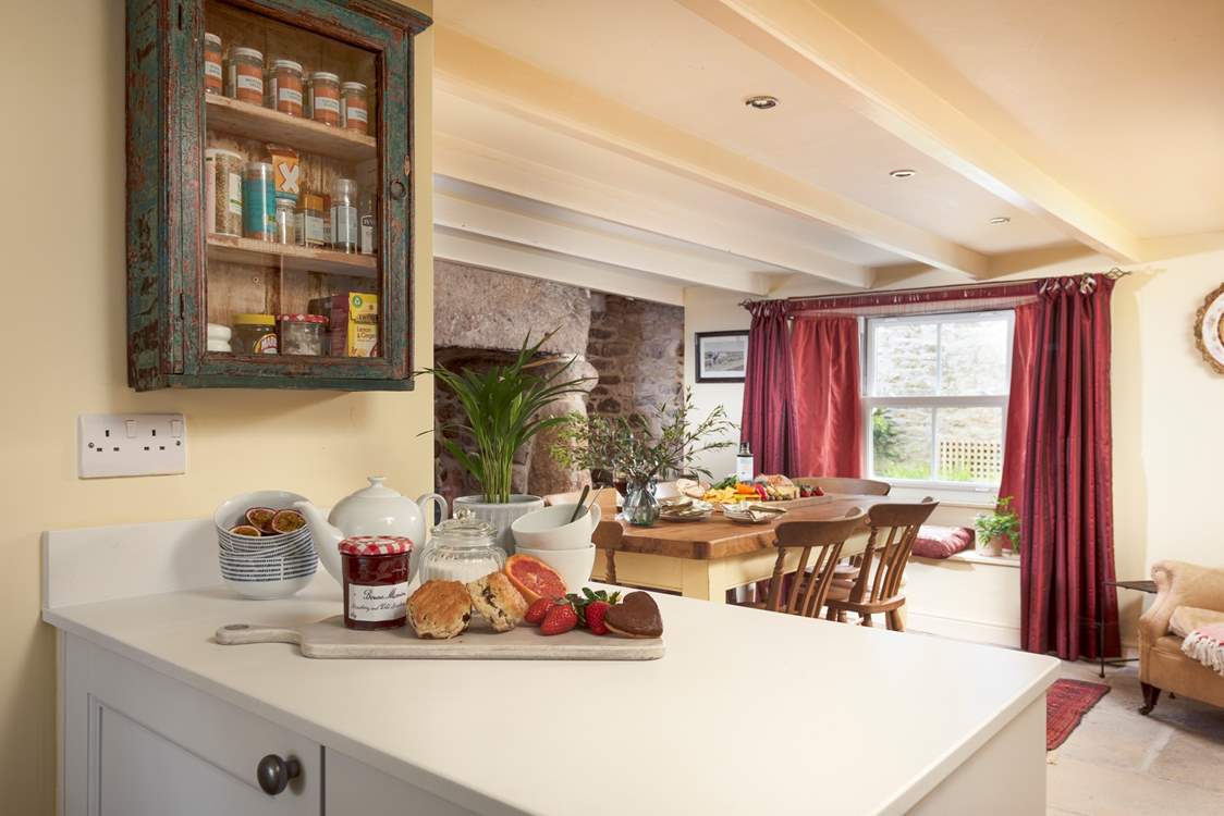 The kitchen leads into the grand dining-room, gather round and plan your holiday adventures.