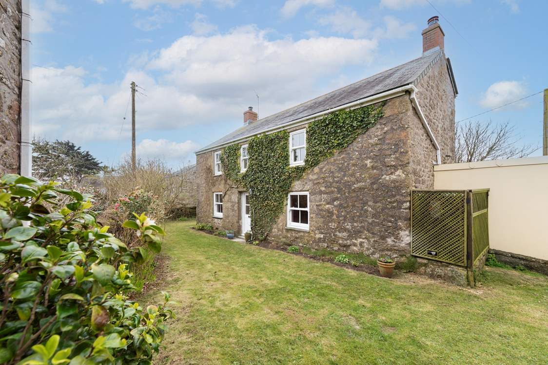 An imposing detached farmhouse with a private garden.