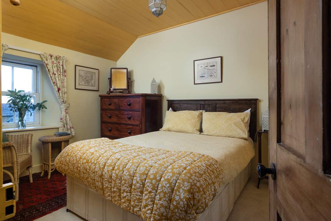 Traditional bedrooms adorned with antique furniture much-loved by the current owners.