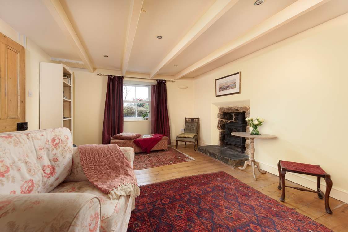 This cosy room is perfect for family gatherings and a charming wood-burner adds perfectly to the ambience.